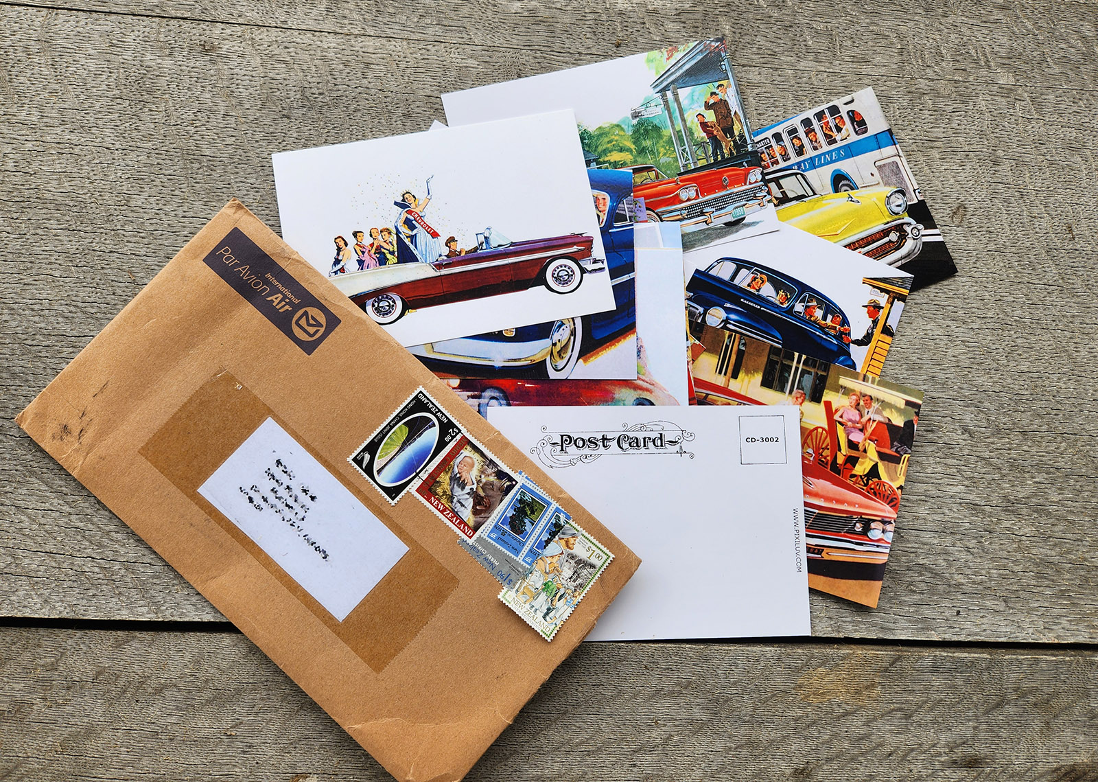 Pixiluv postcard subscription envelope with postcards and New Zealand stamps